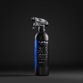 Black spray bottle with blue label on a black background